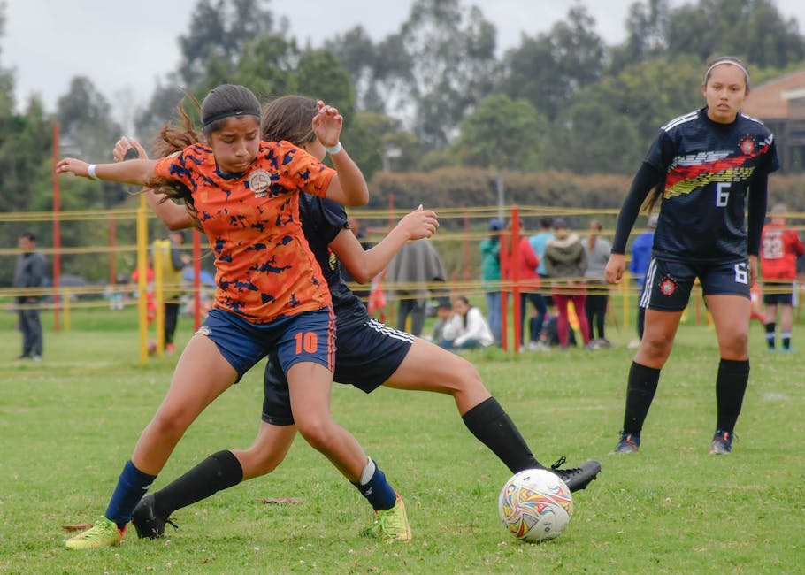 Women soccer players in intense match play