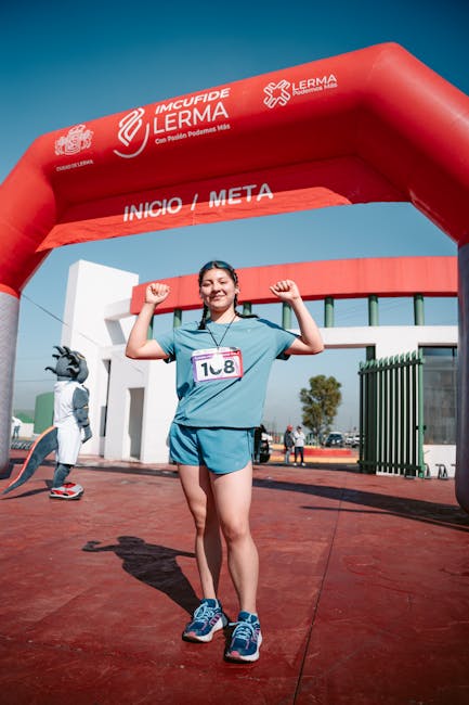 Female athlete celebrating finish line achievement at Lerma event
